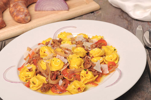 Meat Tortellini with Salsiccia Piccante, Roasted Peppers and Red Onions